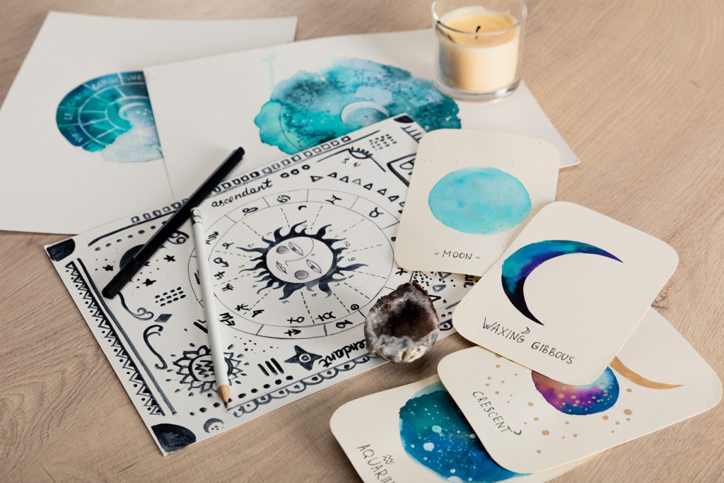 Religious learning materials including books, spell kits, and ritual tools for magical practice and spiritual education