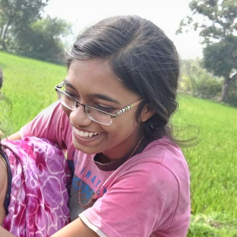 Thirisha from Tamil Nadu, India, smiling in a professional setting, representing her role as the "Voice of Reason" at 71 Connections.