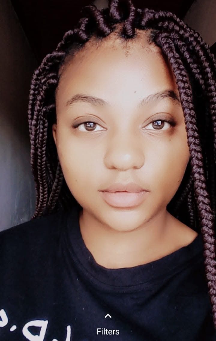 Vuyo of 71 Connections, the team’s "Baseline Baddie," posing confidently in a professional setting that reflects her role in foundation-building for social change.