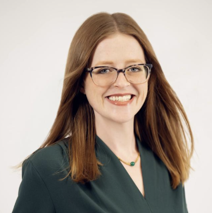 Natalie of 71 Connections, known as the "Good Pirate," smiling in a professional setting that reflects her role in disruptive marketing for social change.